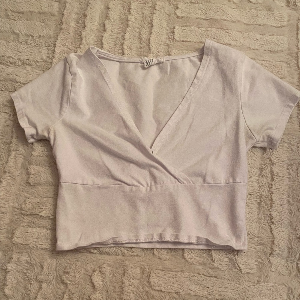 White Crop top from Tillys. Size Small. Brand: Ivy & Main